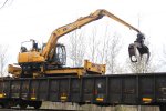 Reaching for a new load of ties